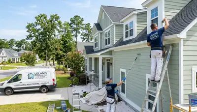 Professional house painters in Wilmington NC finishing exterior home painting project