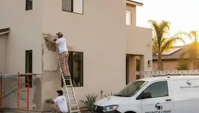Professional stucco repair on coastal home exterior in Wilmington, NC by expert house painters